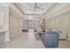 Open-concept living area featuring tile floors, neutral walls and ample natural light at 13 Bayhead Ln, Osprey, FL 34229