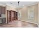 Spacious office features built-in desk, bookcase, and hardwood floors at 13 Bayhead Ln, Osprey, FL 34229