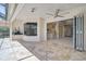 Inviting outdoor patio with a tiled floor and folding doors at 13 Bayhead Ln, Osprey, FL 34229