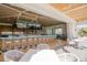 Spacious bar area with comfortable seating and multiple screens for viewing entertainment at 13 Bayhead Ln, Osprey, FL 34229