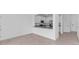 View of the open concept kitchen with white cabinets, granite countertops and stainless appliances at 14783 Lyla Ter, Bradenton, FL 34211