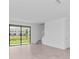Open concept living room boasts tile floors, large window and staircase to the next floor at 14783 Lyla Ter, Bradenton, FL 34211