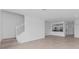 Living room view featuring a staircase, tile floors, and an open kitchen at 14783 Lyla Ter, Bradenton, FL 34211