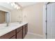 Bathroom featuring a double sink vanity with modern fixtures and a large mirror at 15118 Agave Grove Pl, Bradenton, FL 34212