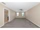 Spacious bedroom featuring neutral walls, plush carpet, ceiling fan, and natural light from windows at 15118 Agave Grove Pl, Bradenton, FL 34212