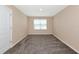 Cozy bedroom with neutral walls and plush carpeting, creating a comfortable and inviting atmosphere at 15118 Agave Grove Pl, Bradenton, FL 34212