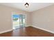 Living room featuring sliding glass doors leading to the backyard at 15118 Agave Grove Pl, Bradenton, FL 34212