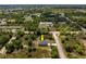 This aerial shows the property and its location within a peaceful, tree-filled residential community at 158 Chickering St, Port Charlotte, FL 33954