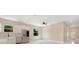 Well lit kitchen featuring stainless steel appliances, modern cabinets and adjacent view of the front door at 158 Chickering St, Port Charlotte, FL 33954