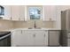 Contemporary kitchen with stainless steel appliances and plenty of white cabinetry space at 158 Chickering St, Port Charlotte, FL 33954