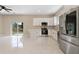 Bright kitchen with white cabinets, stainless steel appliances, and an adjacent dining area at 158 Chickering St, Port Charlotte, FL 33954