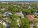 Stunning aerial view of a neighborhood with lush landscaping, showcasing the home's surroundings at 1693 Landings Ln, Sarasota, FL 34231