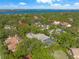 Aerial view of a beautiful neighborhood with lush landscaping at 1693 Landings Ln, Sarasota, FL 34231