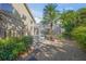 Backyard with pool, spa, screened-in enclosure, and landscaping at 1693 Landings Ln, Sarasota, FL 34231