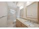 Bathroom with dual sinks, tile floor, and glass-enclosed shower at 1693 Landings Ln, Sarasota, FL 34231