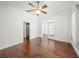 Spacious bedroom with wood floors and easy access to other rooms at 1693 Landings Ln, Sarasota, FL 34231
