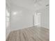 Bright and airy bedroom with wood plank flooring and a ceiling fan at 1693 Landings Ln, Sarasota, FL 34231
