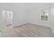 Light-filled bedroom with a large window and walk-in closet at 1693 Landings Ln, Sarasota, FL 34231