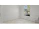 Bright dining room boasts large windows and wainscotting detail at 1693 Landings Ln, Sarasota, FL 34231