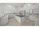 Gourmet kitchen features custom cabinetry, granite counters, and stainless appliances at 1693 Landings Ln, Sarasota, FL 34231