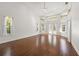 Inviting living room with tray ceilings, natural light and views of the backyard at 1693 Landings Ln, Sarasota, FL 34231