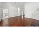 Expansive living room features hardwood floors, neutral paint and view of the kitchen at 1693 Landings Ln, Sarasota, FL 34231
