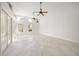 Spacious living area featuring French doors and access to the backyard at 1693 Landings Ln, Sarasota, FL 34231