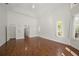 Spacious living room with wood floors, high ceilings and natural light at 1693 Landings Ln, Sarasota, FL 34231