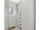 Custom designed walk-in closet with built-in shelving and drawers at 1693 Landings Ln, Sarasota, FL 34231