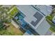 Aerial shot of the property showcasing a modern design, patio, solar panels, and surrounding landscape at 1755 7Th St, Sarasota, FL 34236