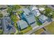 Aerial view showcasing the property, its layout, three-car garage, and surrounding neighborhood at 1755 7Th St, Sarasota, FL 34236