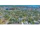 Expansive aerial view of property in a vibrant neighborhood near the cityscape, showcasing mature trees and the area's charm at 1755 7Th St, Sarasota, FL 34236