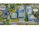 Wide aerial view of the property, showcasing the home, garage, and neighboring residences at 1755 7Th St, Sarasota, FL 34236