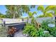 Secluded backyard featuring a COVANA hot tub surrounded by lush landscaping at 1755 7Th St, Sarasota, FL 34236