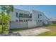 The home's outdoor patio features a gray privacy fence and a partial view of a second-story balcony at 1755 7Th St, Sarasota, FL 34236