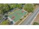 Aerial view of a basketball court with a nearby sidewalk and road, providing a recreational space in the community at 1755 7Th St, Sarasota, FL 34236