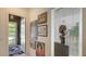 Chic entryway with modern art, a unique sculpture, and a bright, window-filled door, creating an inviting space at 1755 7Th St, Sarasota, FL 34236