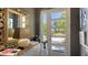 Elegant entryway featuring a white door with sidelights and a view of the outdoors, alongside stylish decor at 1755 7Th St, Sarasota, FL 34236