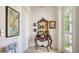 A formal foyer features an ornate mirror and table with tile flooring at 1755 7Th St, Sarasota, FL 34236