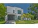 Contemporary two-story home featuring clean lines, modern windows, and well-manicured front lawn at 1755 7Th St, Sarasota, FL 34236