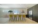 Modern kitchen with bar seating, center island, and stainless steel appliances at 1755 7Th St, Sarasota, FL 34236