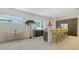 Well-lit kitchen featuring modern cabinetry, a central island with seating, and sleek appliances at 1755 7Th St, Sarasota, FL 34236
