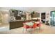 Modern kitchen with sleek cabinets, stainless steel appliances, and a stylish dining table at 1755 7Th St, Sarasota, FL 34236