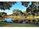 Picturesque view of a tranquil lake surrounded by lush trees and a charming gazebo, creating a serene park atmosphere at 1755 7Th St, Sarasota, FL 34236