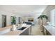 Bright, modern living room featuring an open kitchen with stainless steel appliances and sleek countertops at 1755 7Th St, Sarasota, FL 34236