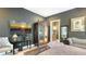 Alternate view of the main bedroom with antique cabinet and television at 1755 7Th St, Sarasota, FL 34236