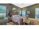 Angle view of the main bedroom featuring a statement bed and natural light at 1755 7Th St, Sarasota, FL 34236