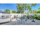 This lovely patio features an outdoor kitchen, dining table, garden, and hot tub at 1755 7Th St, Sarasota, FL 34236