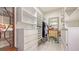 Spacious walk-in closet with custom shelving and drawers for storage at 1755 7Th St, Sarasota, FL 34236