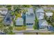 Aerial view of the property highlighting its mature trees and proximity to other homes at 1765 7Th St, Sarasota, FL 34236